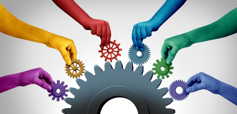 A graphic of different-colored hands holding meshing gears illustrates how the Kolbe Method unlocks instinctual diversity and improves organizational functionality.